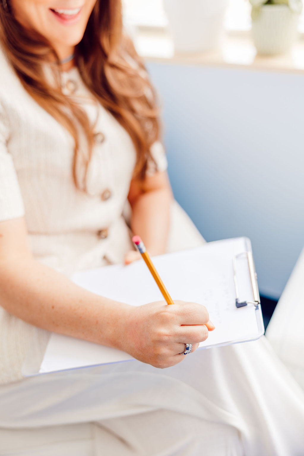Dr. Megan Baldassarre taking notes during a neuropsychological evaluation session